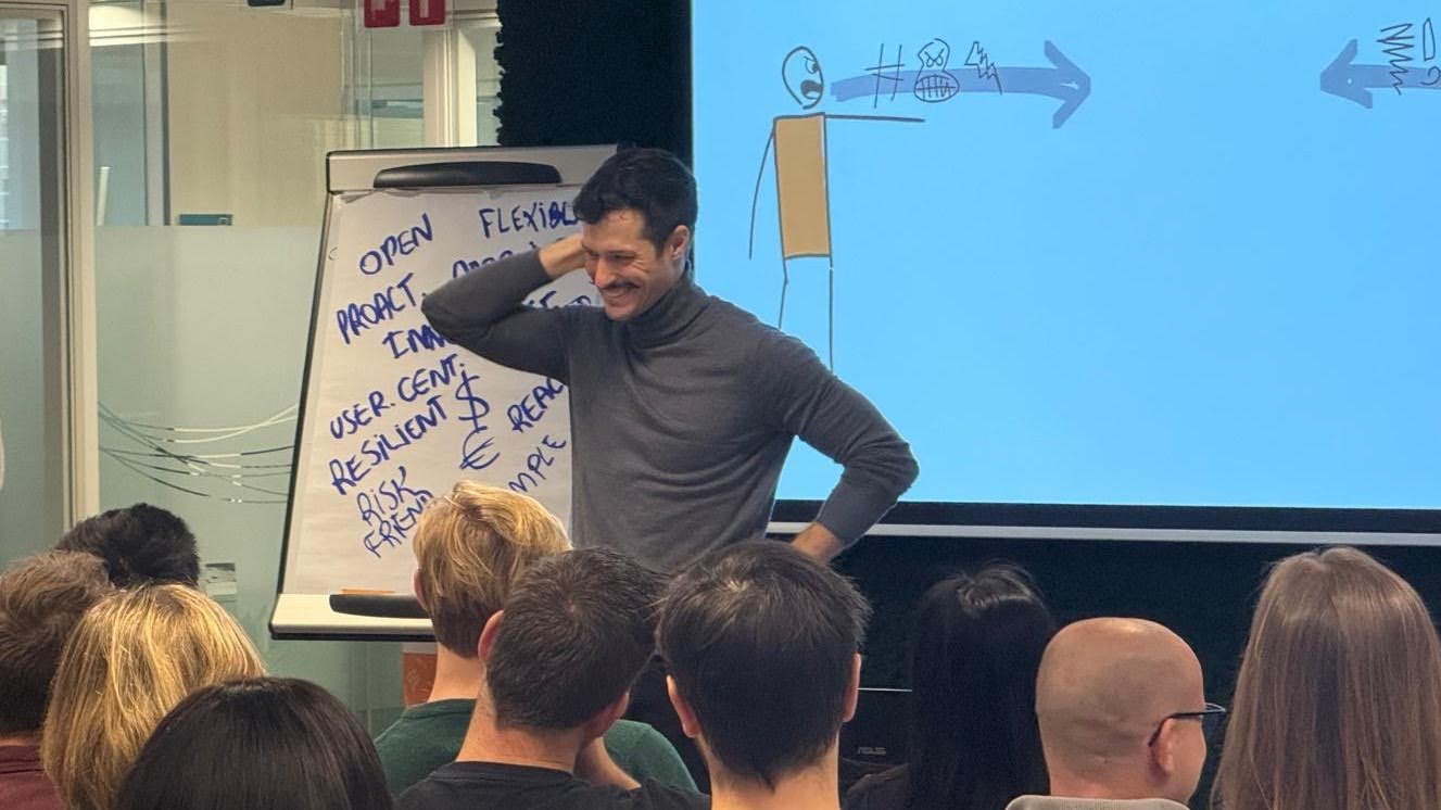 Artur speaking with an audience during a leadership keynote