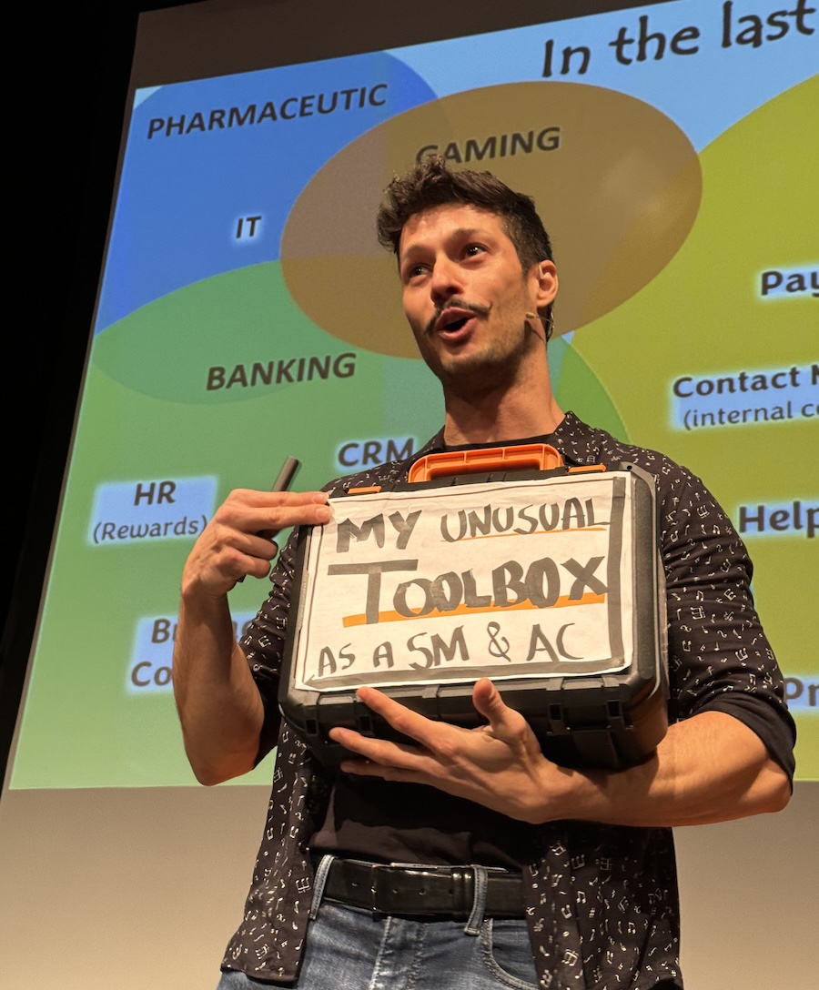 Artur holding the unusual toolbox on stage